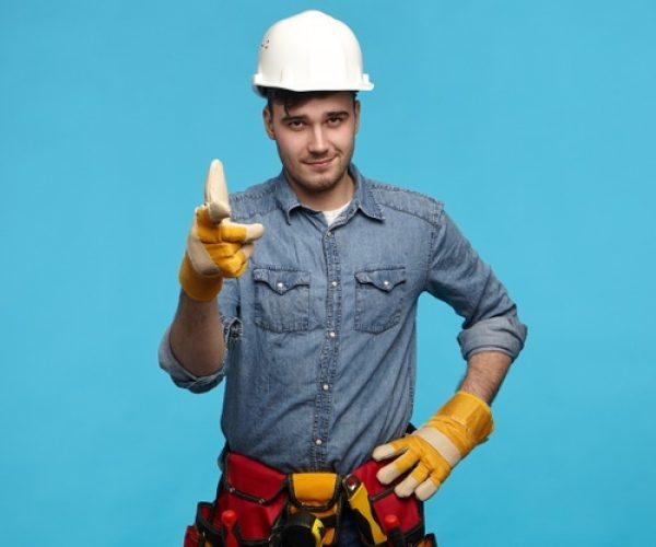 horizontal-shot-handsome-young-maintenance-service-worker-wearing-white-helmet_343059-3521